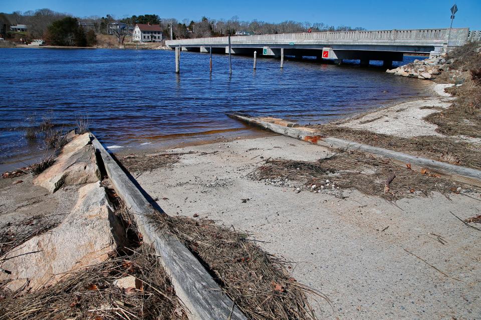 Two men fish from Hix bridge in Westport, in the foreground the boat ramp which residents want replaced.