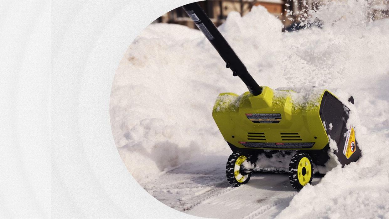 ryobi electric snow shovel removing snow on sidewalk