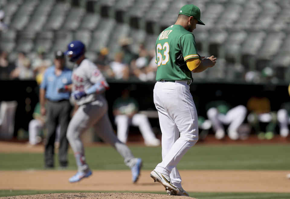 Oakland Athletics pitcher Norge Ruiz (63) walks back to the mound as New York Mets designated hitter Pete Alonso (20) rounds the bases after hitting a home run in the fourth inning of a baseball game in Oakland, Calif., on Sunday, Sept. 25, 2022. (AP Photo/Scot Tucker)