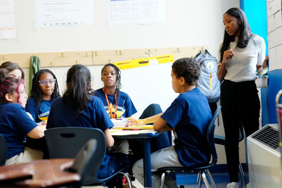 Ezera Washington (right) teaches a fifth grade guided reading class at College Achieve Public Charter School, Thursday, April 11, 2024, in Paterson.