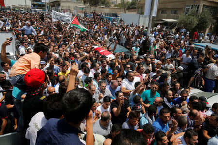 People attend the funeral of Mohammad Jawawdah in Amman, Jordan July 25, 2017. REUTERS/Muhammad Hamed