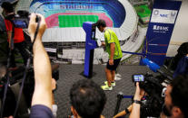 NEC Green Rockets' rugby player Teruya Goto demonstrates the face recognition system for Tokyo 2020 Olympics and Paralympics, which is developed by NEC corp, in Tokyo, Japan August 7, 2018. REUTERS/Toru Hanai