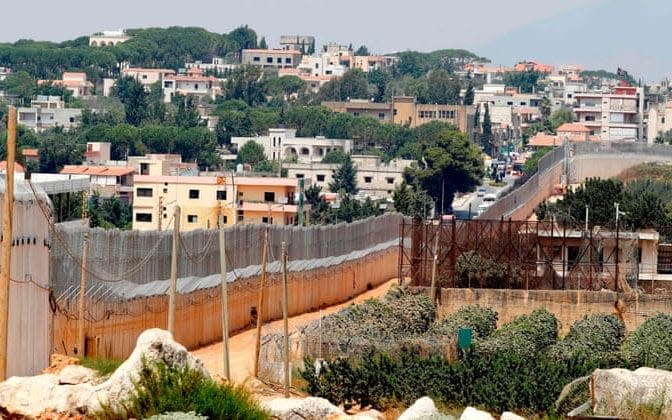 The concrete barrier along Israel’s border with the southern Lebanese village of Kfar Kila. - AFP