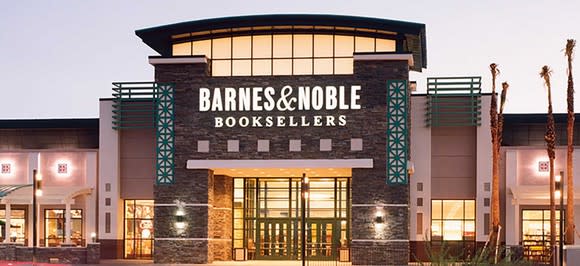 Barnes & Noble storefront lit up in evening.