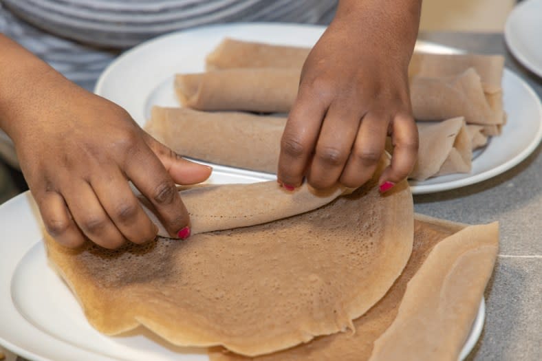 Injera, the Ethiopian flatbread, is often used as a utensil. (Adobe Stock)