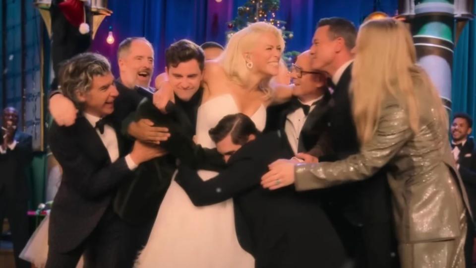 The “Ted Lasso” cast and more hug Hannah Waddingham in “Hannah Waddingham: Home for Christmas” (Apple TV+)