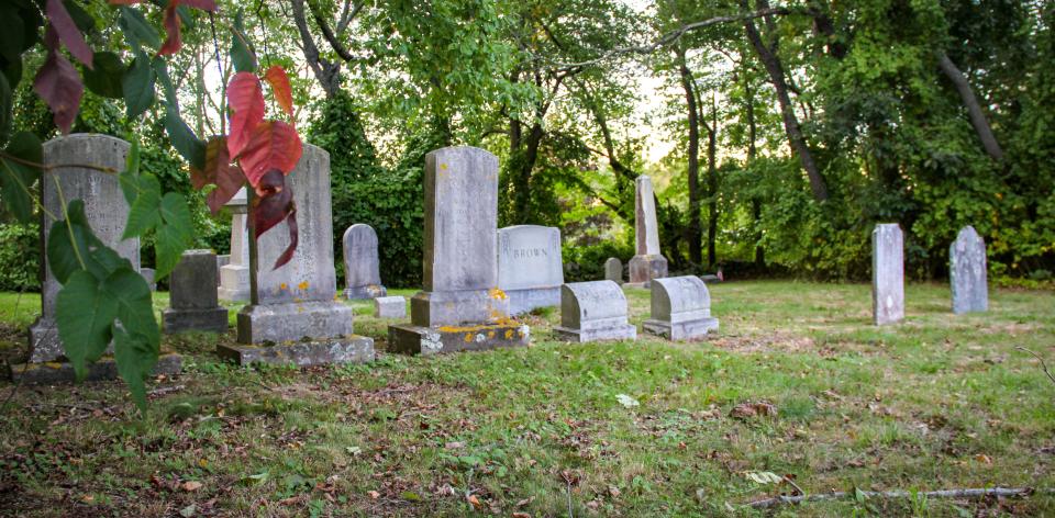 Gravestones stand in Valentine-Reed Cemetery on North Main Street in Fall River.