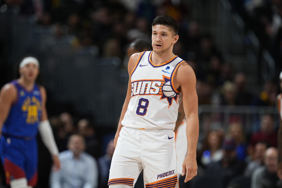 Phoenix Suns guard Grayson Allen reacts after hitting a 3-point basket against the Denver Nuggets during the first half of an NBA basketball game Tuesday, March 5, 2024, in Denver. (AP Photo/David Zalubowski)