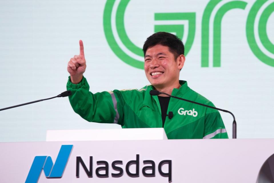 Anthony Tan, chief executive officer of Grab Holdings Inc., addresses the audience during a bell-ringing ceremony as Grab begins trading on the Nasdaq, in Singapore, on Thursday, Dec. 2, 2021. Grab Holdings Ltd., Southeast Asias ride-hailing and delivery giant, rose in the first day of trading after completing its merger with Altimeter Growth Corp., the largest deal yet for a special purpose acquisition company. Photographer: Ore Huiying/Bloomberg via Getty Images