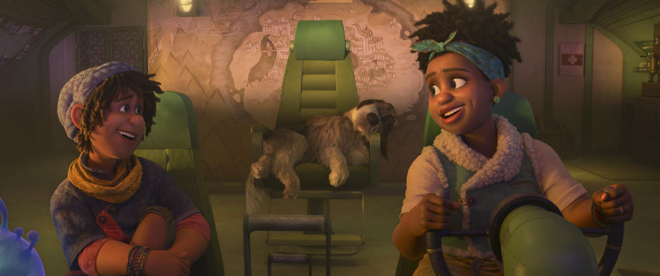 This image released by Disney shows Ethan, voiced by Jaboukie Young-White, left, with his mother Meridian Clade, voiced by Gabrielle Union, in a scene from the animated film "Strange World." (Disney via AP)