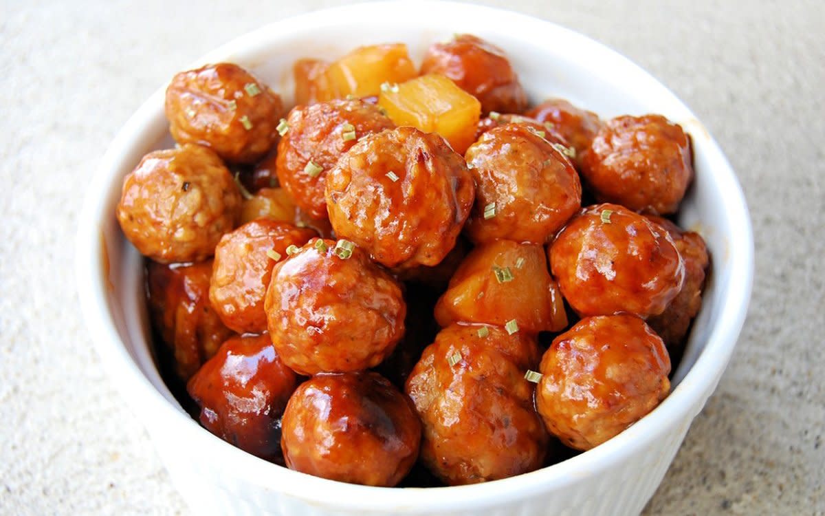 <p>Krista Marshall</p><p>Barbecue sauce and pineapple give these meatballs immense flavor. Perfect for a party app, or served over rice for a simple supper.</p><p><strong>Get the recipe: <a href="https://parade.com/842803/kristamarshall/slow-cooker-hawaiian-meatballs/" rel="nofollow noopener" target="_blank" data-ylk="slk:Slow Cooker Hawaiian Meatballs;elm:context_link;itc:0;sec:content-canvas" class="link rapid-noclick-resp">Slow Cooker Hawaiian Meatballs</a></strong></p><p><strong>Related: 42 <a href="https://parade.com/1013793/felicialim/best-rice-bowl-recipes/" rel="nofollow noopener" target="_blank" data-ylk="slk:Simple Rice Bowl Recipes;elm:context_link;itc:0;sec:content-canvas" class="link rapid-noclick-resp">Simple Rice Bowl Recipes</a></strong></p>