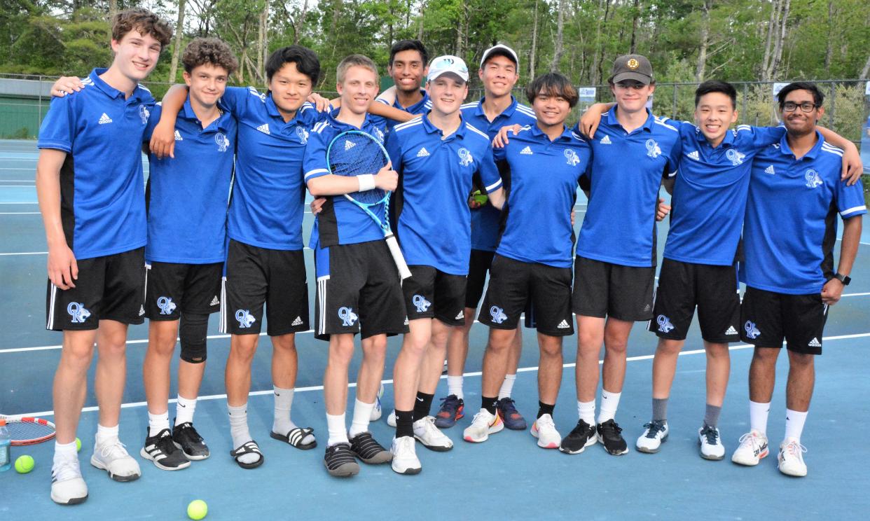 Members of the Oyster River High School boys tennis team celebrate Monday's 6-3 win over Windham in a Division II semifinal.