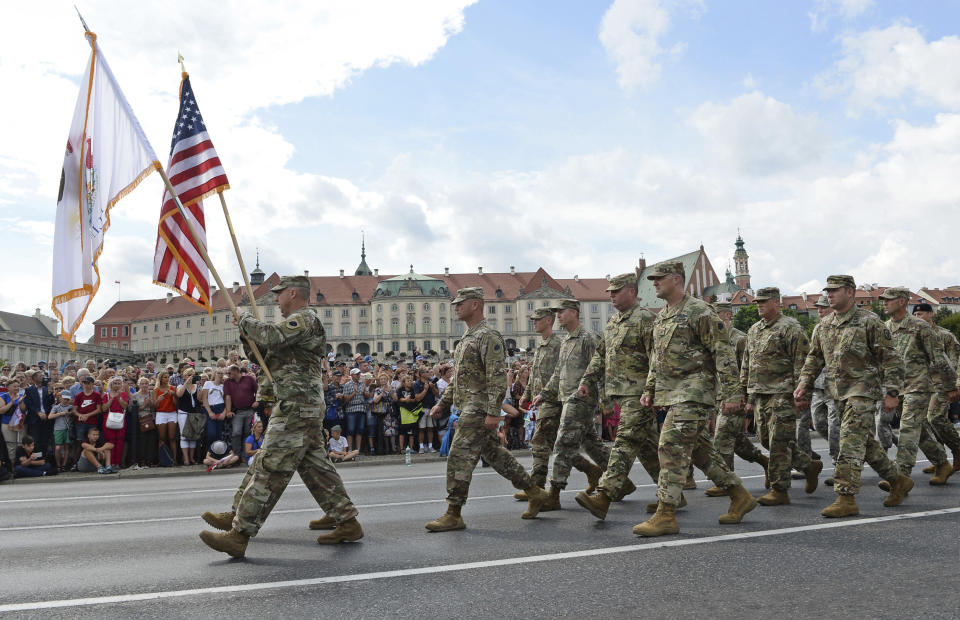 A group of US Army soldiers take part in a yearly military parade celebrating the Polish Army Day in Warsaw, Poland, Wednesday, Aug. 15, 2018. Poland marks Army Day with a parade and a call for US permanent military base in Poland. (AP Photo/Alik Keplicz)