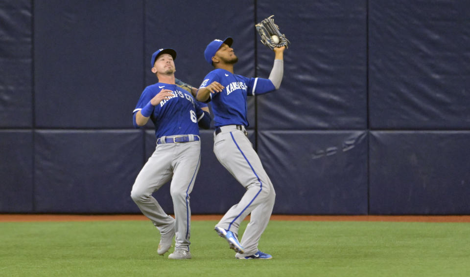 Kansas City Royals left fielder Edward Olivares, right, grabs a fly ball hit by Tampa Bay Rays' Yandy Diaz in front of center fielder Drew Waters during the first inning of a baseball game Saturday, June 24, 2023, in St. Petersburg, Fla. (AP Photo/Steve Nesius)