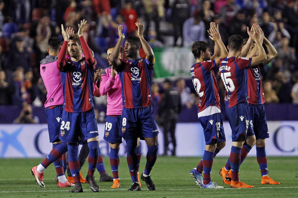 Levante’s players celebrates their victory against Barcelona during the Spanish La Liga soccer match between Levante and Barcelona at the Ciutat de Valencia stadium in Valencia, Spain, Sunday, May 13, 2018. (AP Photo/Alberto Saiz)