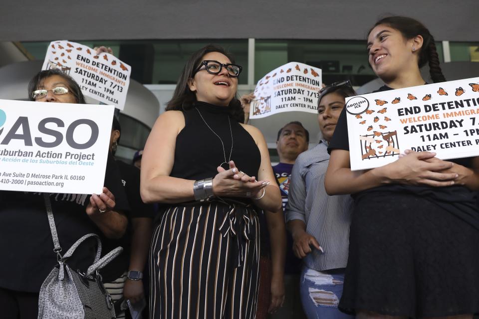 Mony Ruiz-Velasco, center, director of PASO West Suburban Action Project, chants with demonstrators following a new conference outside the U.S. Citizenship and Immigration Services offices in Chicago, Thursday, July 11, 2019. A nationwide immigration enforcement operation targeting people who are in the United States illegally is expected to begin this weekend. (AP Photo/Amr Alfiky)