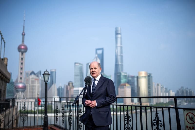 Germany's Chancellor Olaf Scholz speaks during a press statement in Shanghai. Scholz is scheduled to meet China's President Xi Jinping in Beijing at the end of his trip. Michael Kappeler/dpa