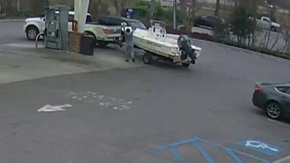 In this still image taken from security camera video, Paul Murdaugh appears to be celebrating that he was able to successfully purchase alcohol, says Michael DeWitt, the editor of The Hampton County Guardian, who has covered the story. Seconds later, Paul can be seen loading the cooler in the boat. / Credit: South Carolina Division of Natural Resources