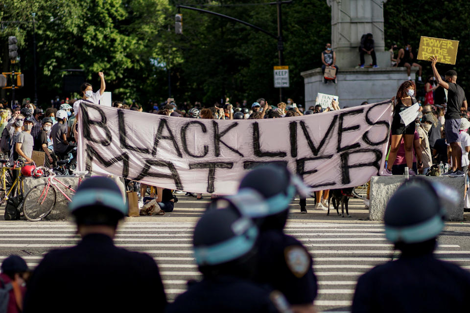 Demonstrators hold a Black Lives Matter banner during a protest against racial inequality in the aftermath of the death in Minneapolis police custody of George Floyd, in front of the at Grand Army Plaza in the Brooklyn borough of New York City, New York, U.S. June 7, 2020. REUTERS/Eduardo Munoz     TPX IMAGES OF THE DAY