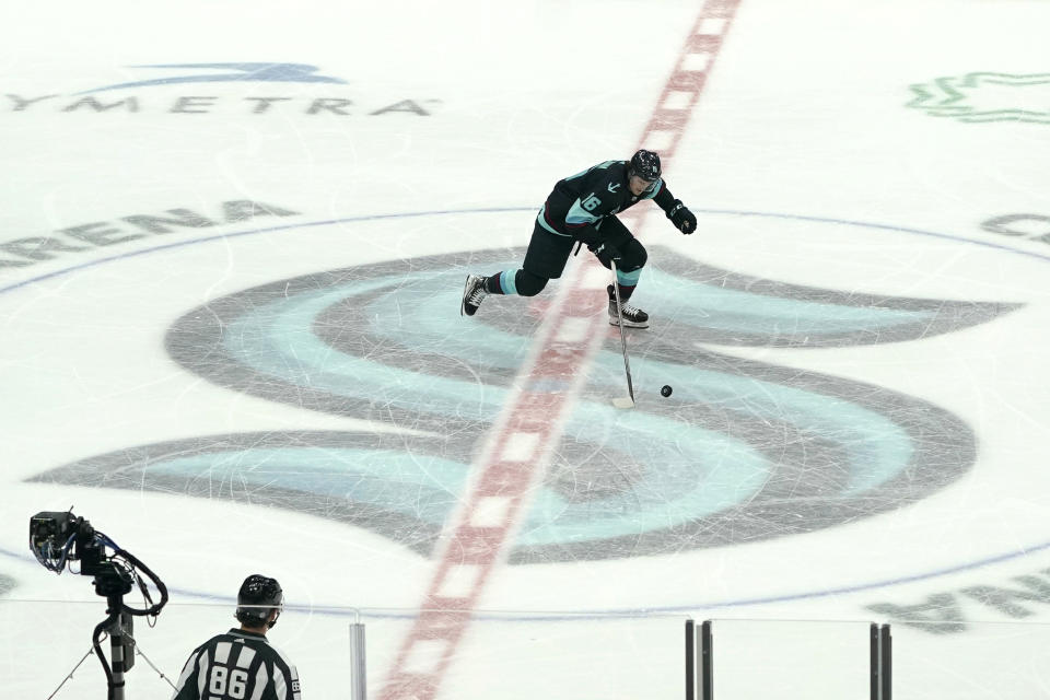 Seattle Kraken left wing Jared McCann takes off from center ice to shoot a penalty shot against the Chicago Blackhawks during the third period of an NHL hockey game, Monday, Jan. 17, 2022, in Seattle. McCann did not score on this play but the Kraken won 3-2 after a shootout following overtime. (AP Photo/Ted S. Warren)