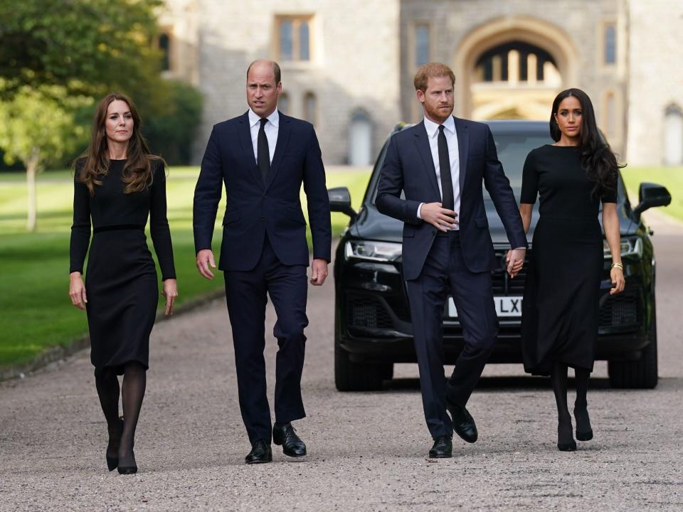 Prince William, Princess Kate, Prince Harry, and Meghan Markle on a walk at Windsor Castle