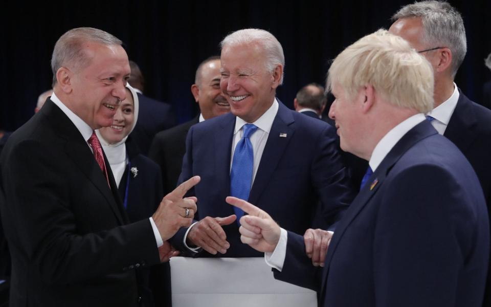 Turkish President, Recep Tayyip Erdogan; US President, Joe Biden, and British Prime Minister, Boris Johnson talk at the Nato summit in Madrid today - Juan Carlos Hidalgo/Shutterstock