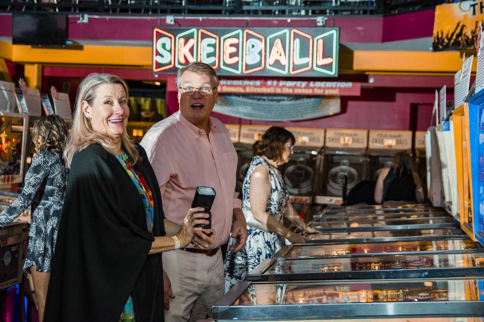 Two attendees enjoy the inaugural Pinball for a Cause gala held last month at the Silverball Museum in Delray Beach. The event raised $15,000 for individuals with autism, Down syndrome and other forms of intellectual and developmental disabilities served by The Arc of Palm Beach County.