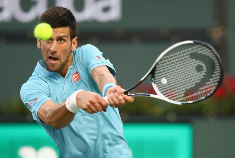 Novak Djokovic of Serbia plays a backhand against Kyle Edmund of Britain during their BNP Paribas Open second round match, at Indian Wells Tennis Garden in California, on March 12, 2017