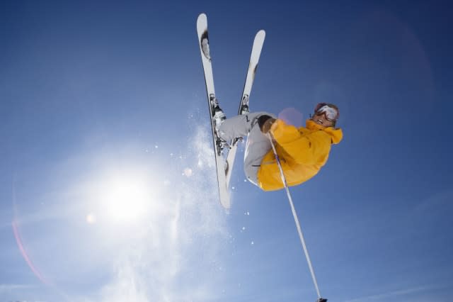 Skier jumping shot from bellow