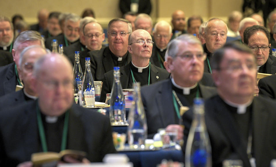 Bishops are seated during the opening moments of the United States Conference of Catholic Bishops Fall General Assembly at the Baltimore Marriott Waterfront Monday, Nov. 11, 2019. (Jerry Jackson/The Baltimore Sun via AP)