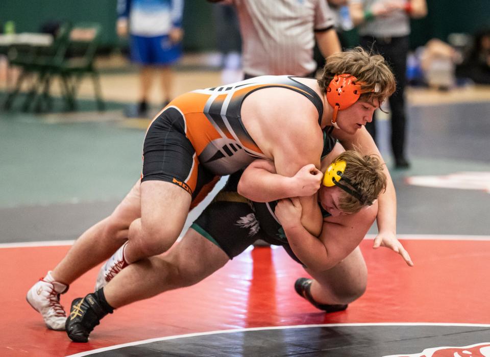 Dolphin Robert Wills wrestles Chase Pelfrey, from Choctawhatchee, in the 285-pound division class. Mosley High School hosted the regional wrestling tourney Saturday, February 28, 2021.