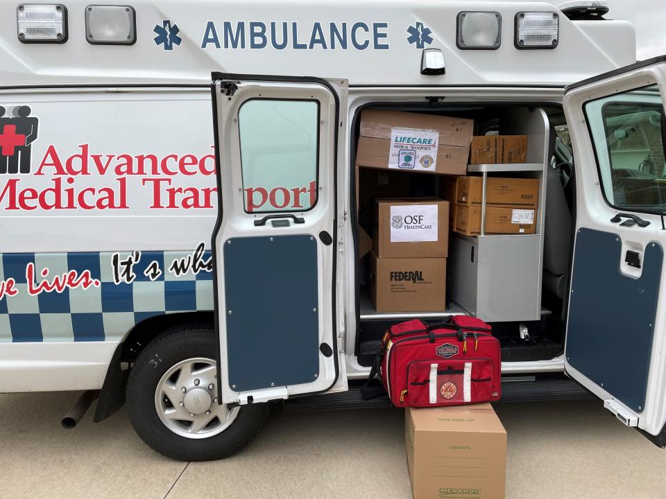 A donated AMT ambulance is filled with medical supplies before shipping off to Ukraine.