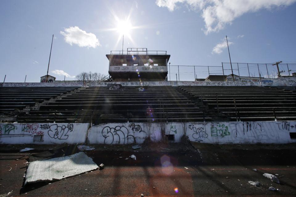 This Thursday, March 14, 2013 photo shows a graffiti covered press box and stands and deteriorated artificial turf in Hinchliffe Stadium in Paterson, N.J. Built as a public works project municipal stadium in 1932, Hinchliffe, listed on the state and National Register of Historic Places, served as home to the New York Black Yankees of the Negro National League from 1933-37 and 1939-45. (AP Photo/Mel Evans)
