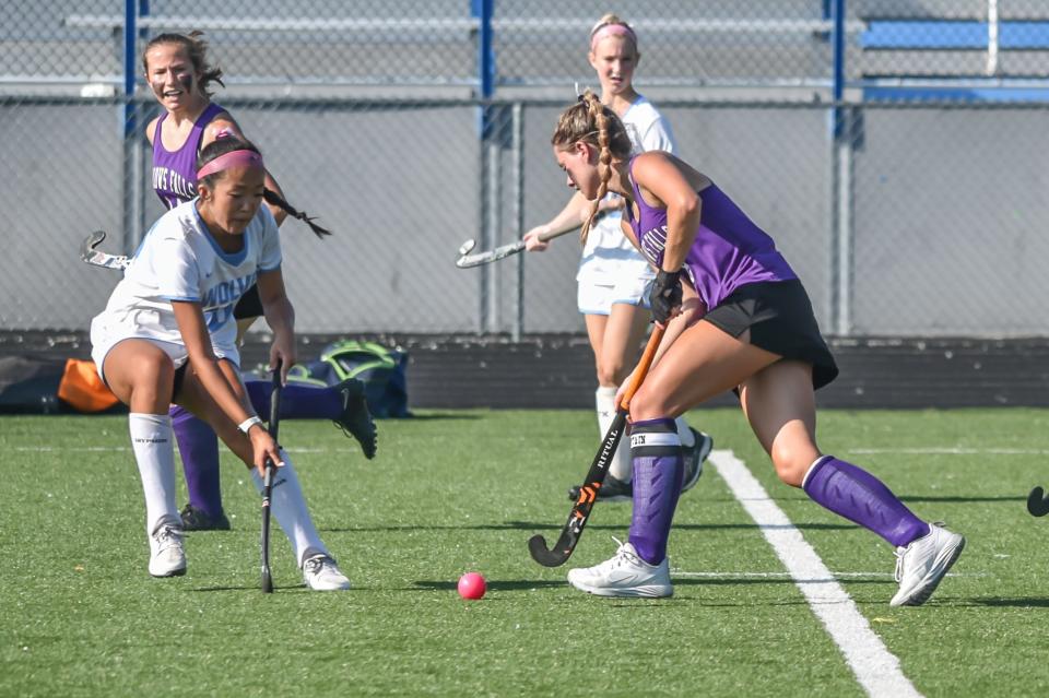 Bellows Falls' Ava LaRoss works to get by South Burlington's Kayla Kim during the Terriers' 3-0 loss to the Wolves earlier this season in South Burlington.