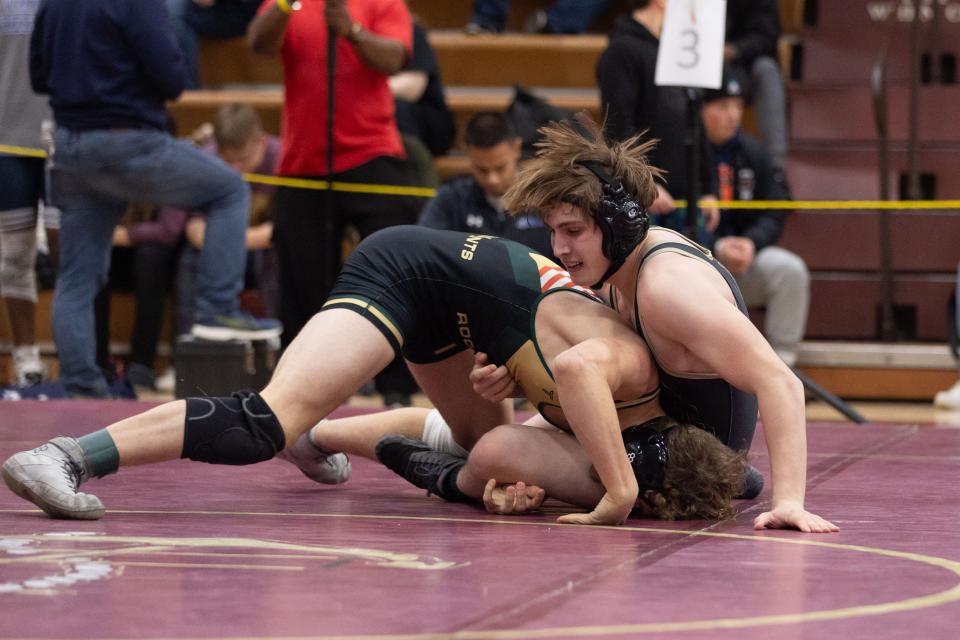 FRD's Tray Bilyou, left wrestles Arlington's Xavier Realmuto, right in the 57th Mid-Hudson wrestling Tournament in LaGrange, NY on December 28, 2023.