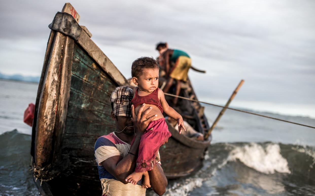 At Sharparidip in Bangladesh, boats arrive from Myanmar bringing fleeing Rohingya people - Kathleen Prior