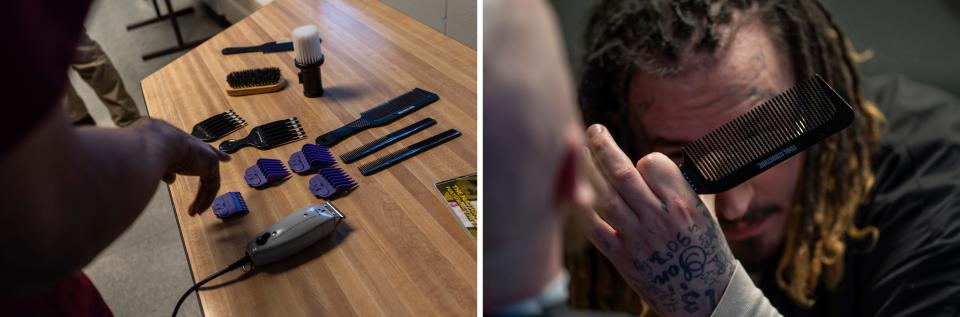 LEFT: Shaqur Brewer looks over guards and combs with a set of clippers during a one-hour barber course for a small group of incarcerated men as part of the I.G.N.I.T.E. (Inmate Growth Naturally and Intentionally Through Education) program held in an activities room of the Genesee County Jail in Flint on Thursday, Jan. 4, 2024. RIGHT: Eryn Carver, right, adjusts his glasses while working from different angles to cut the beard of James Wheeler, during a one-hour barber course. Carver, who has worked with tattoos, uses his eye for balancing the cut.