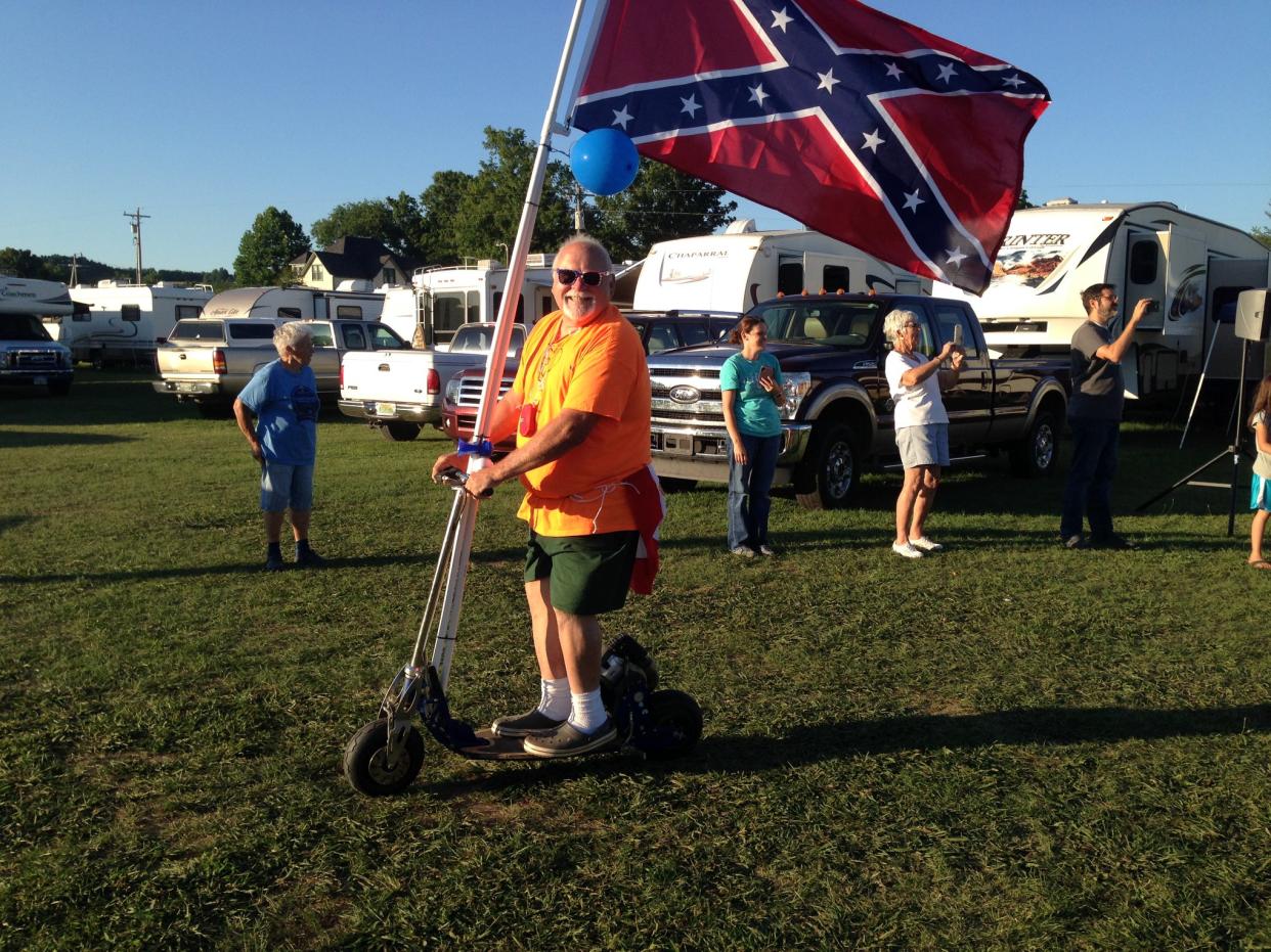 A photo of a man proudly parading the Confederate flag at a Diana Singing event has come under fire. (Credit: Madison Laird)