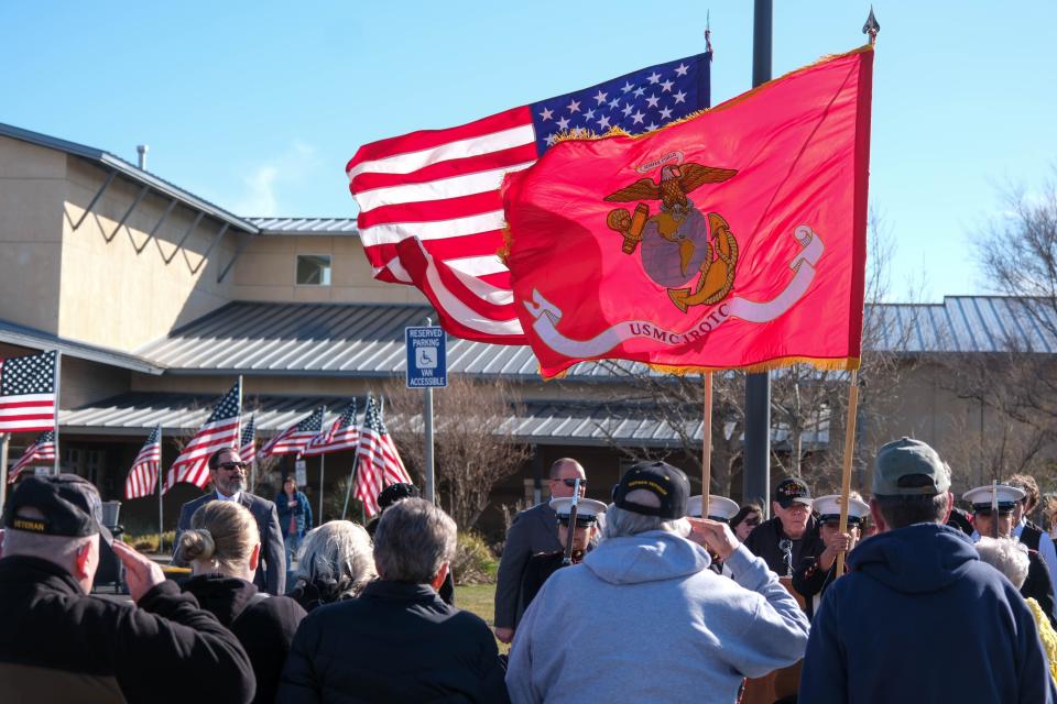 A veteran salutes the colors at the opening ceremony for the Vietnam Traveling Memorial Wall Wednesday at the Ussery-Roan Texas State Veterans Home in Amarillo.