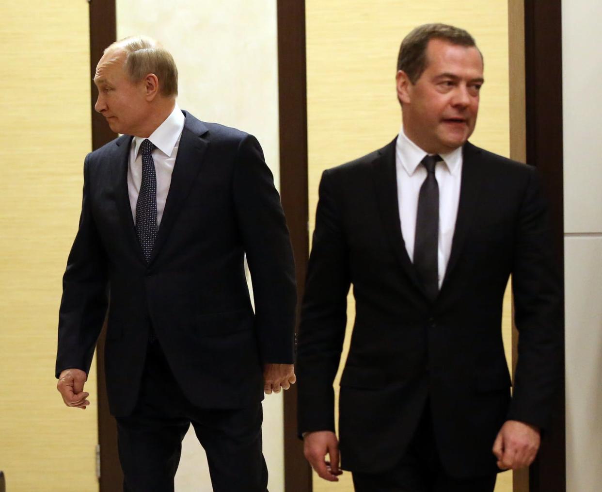 <span class="caption">Russian President Vladimir Putin (L) and now-former Prime Minister Dmitry Medvedev (R) in Sochi, Russia, Dec. 7, 2019. </span> <span class="attribution"><a class="link " href="https://www.gettyimages.com/detail/news-photo/russian-president-vladimir-putin-and-russian-prime-minister-news-photo/1186838144" rel="nofollow noopener" target="_blank" data-ylk="slk:Mikhail Svetlov/Getty Images;elm:context_link;itc:0;sec:content-canvas">Mikhail Svetlov/Getty Images</a></span>