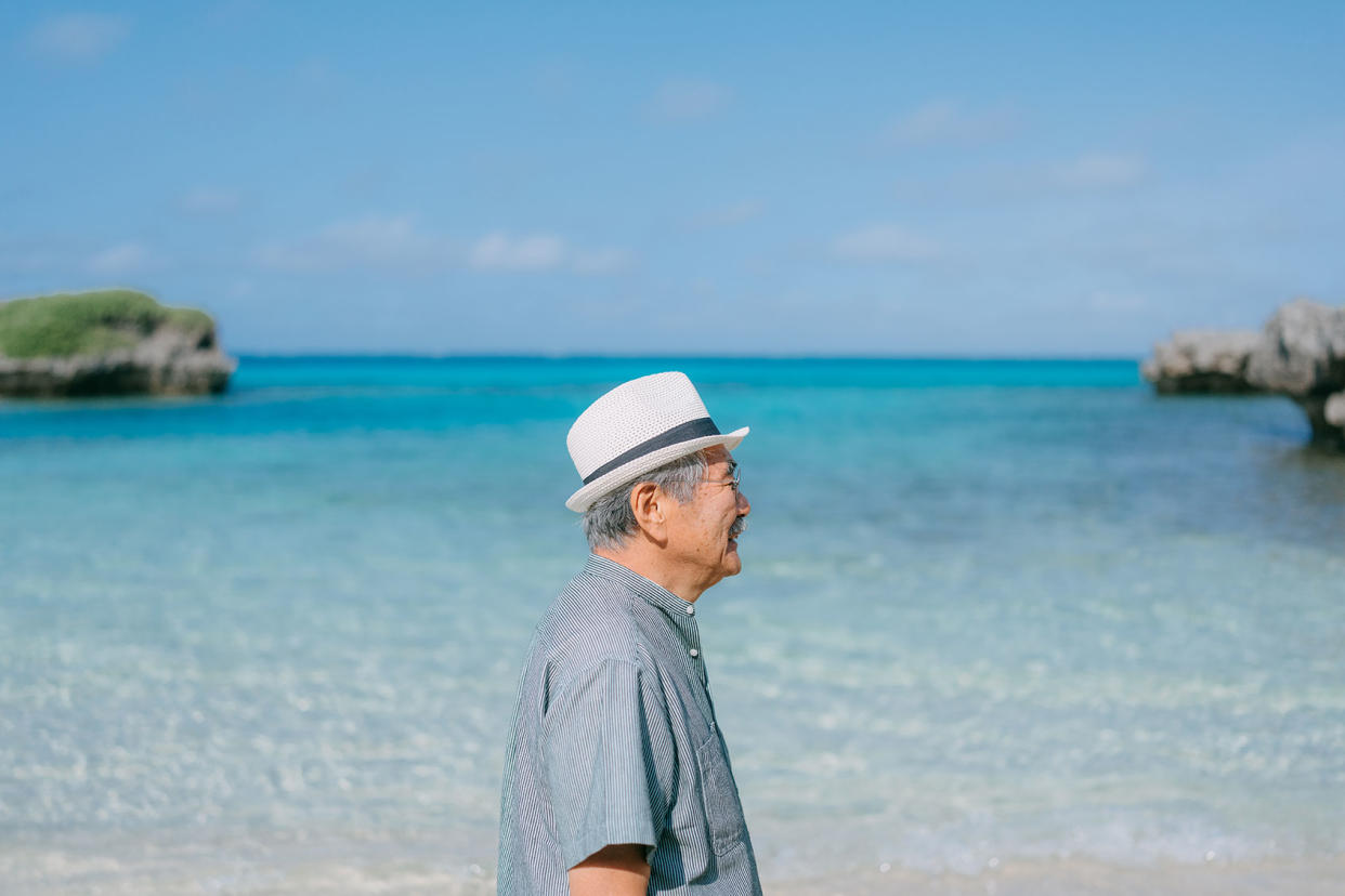 Senior Japanese man on tropical beach, Ikema Island of Miyako Islands, Okinawa, Japan Getty Images/Ippei Naoi