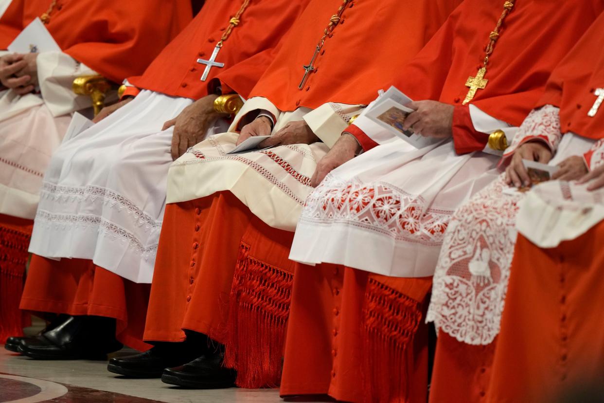 New Cardinals sit during consistory inside St. Peter's Basilica.