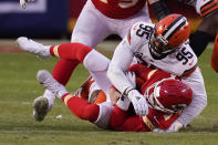 Kansas City Chiefs quarterback Chad Henne is sacked by Cleveland Browns defensive end Myles Garrett (95) during the second half of an NFL divisional round football game, Sunday, Jan. 17, 2021, in Kansas City. (AP Photo/Charlie Riedel)