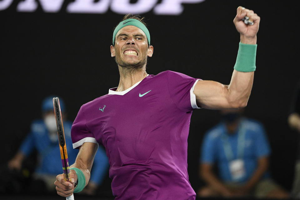 Rafael Nadal of Spain celebrates his win over Karen Khachanov of Russia in their third round match at the Australian Open tennis championships in Melbourne, Australia, Saturday, Jan. 22, 2022. (AP Photo/Andy Brownbill)