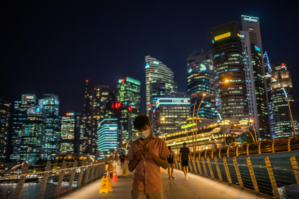 A man walks along the Merlion Park, a major tourist attraction in Singapore. (PHOTO: LightRocket via Getty Images)