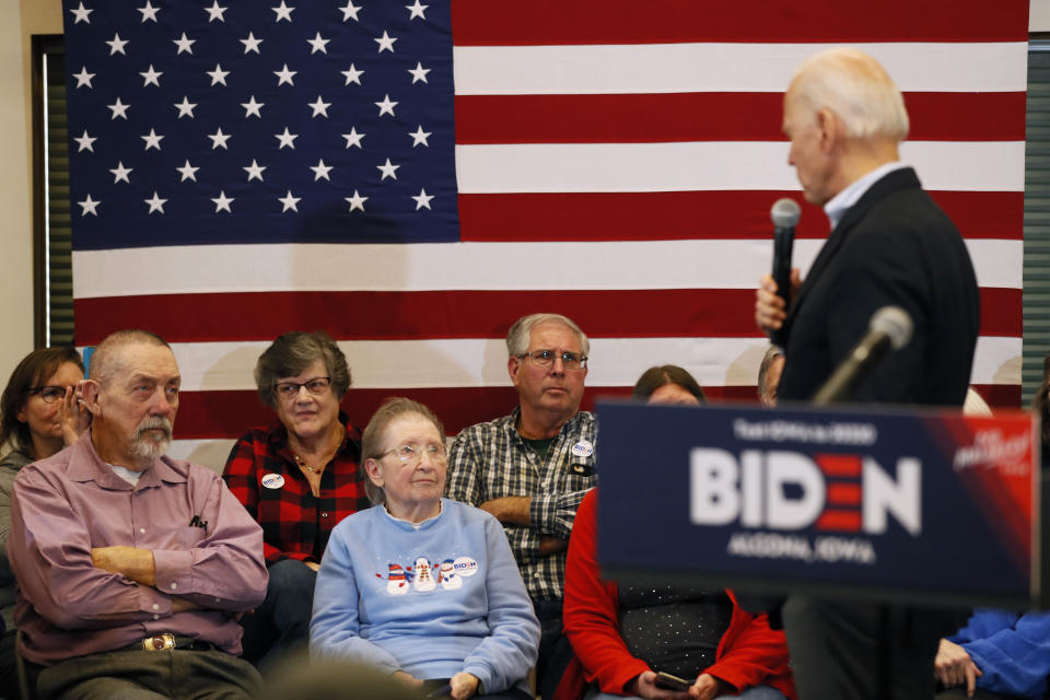 Audience members listen to Democratic presidential candidate former U.S. Vice President Joe Biden speak during a bus tour stop at Water's Edge Nature Center, Monday, Dec. 2, 2019, in Algona, Iowa. (AP Photo/Charlie Neibergall)