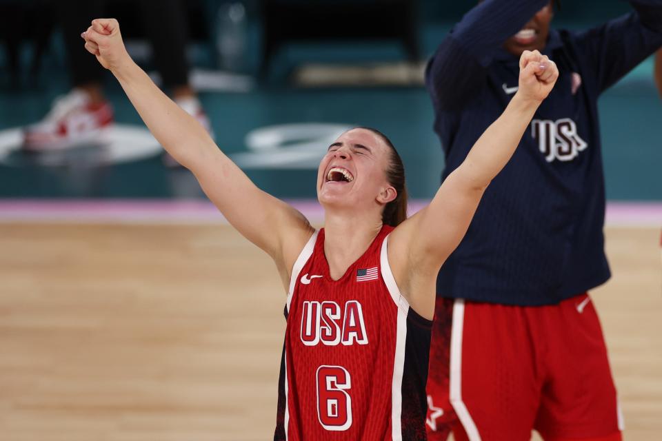 PARIS, FRANCE - AUGUST 11: Sabrina Ionescu #6 of Team United States celebrates after her team's victory against Team France during the Women's Gold Medal game between Team France and Team United States on day sixteen of the Olympic Games Paris 2024 at Bercy Arena on August 11, 2024 in Paris, France. (Photo by Sarah Stier/Getty Images) ORG XMIT: 776138675 ORIG FILE ID: 2166338433