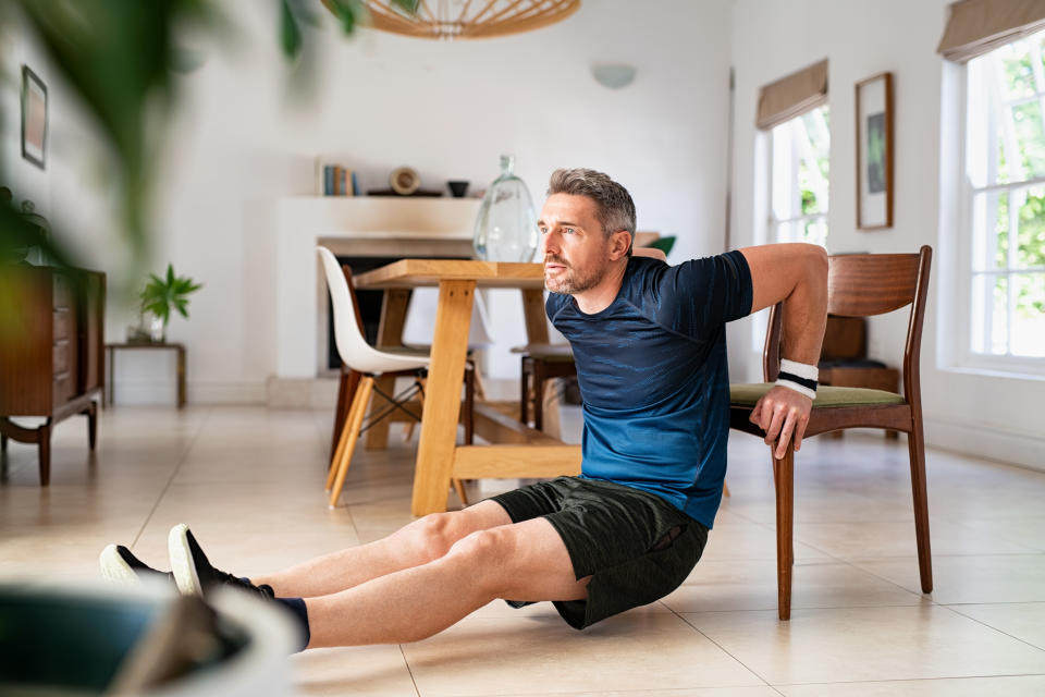 Man doing exercise on chair