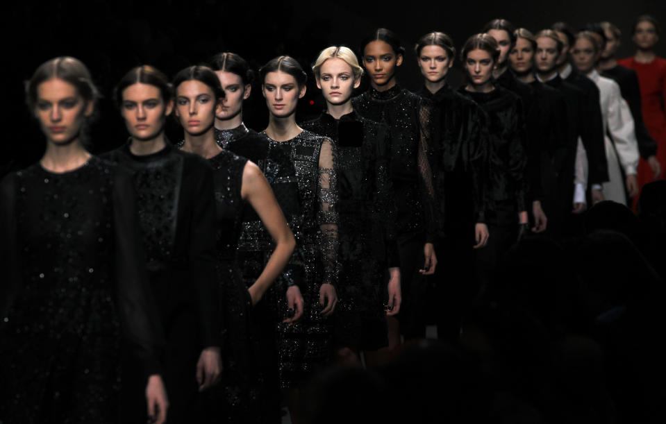 Models wear creations by Maria Grazia Chiuri and Pier Paolo Piccioli for Valentino as part of the Fall-Winter, ready-to-wear 2013 fashion collection, during Paris Fashion week, Tuesday, March 6, 2012. (AP Photo/Christophe Ena)