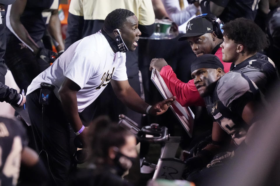 Vanderbilt head coach Derek Mason talks to his players in the second half of an NCAA college football game against LSU Saturday, Oct. 3, 2020, in Nashville, Tenn. LSU won 41-7. (AP Photo/Mark Humphrey)